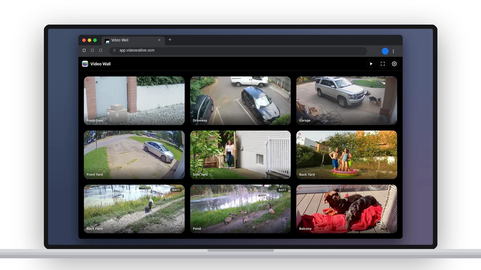 A laptop with Video Wall open in a browser tab: nine Ring cameras live in a grid