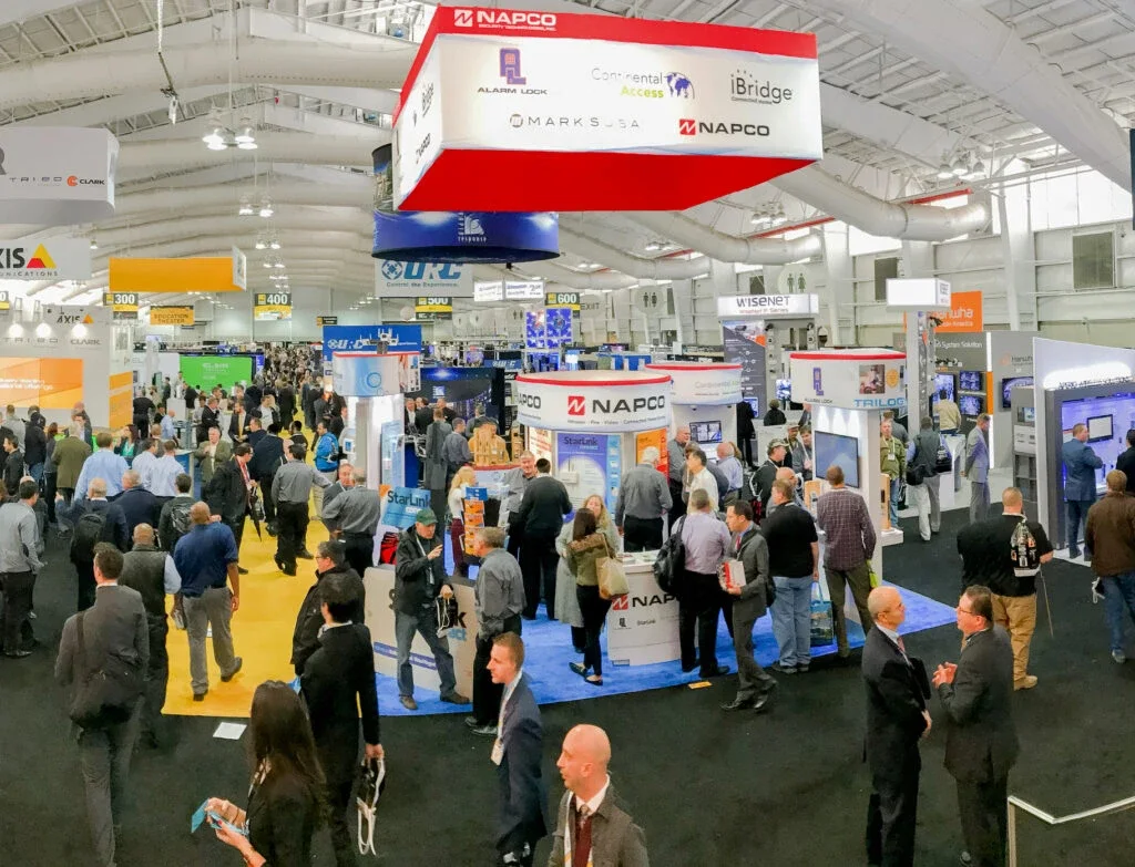 The ISC East exhibit hall at the Javits Center, crowded with attendees walking between security manufacturers' booths