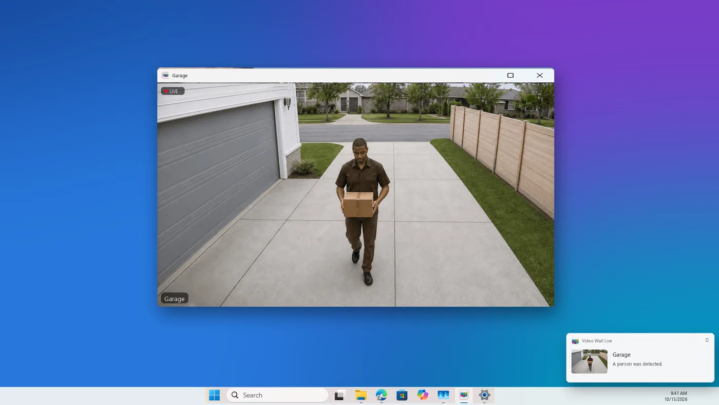 A Video Wall Live notification on Windows — Garage, A person was detected — with the Garage camera open in its own window